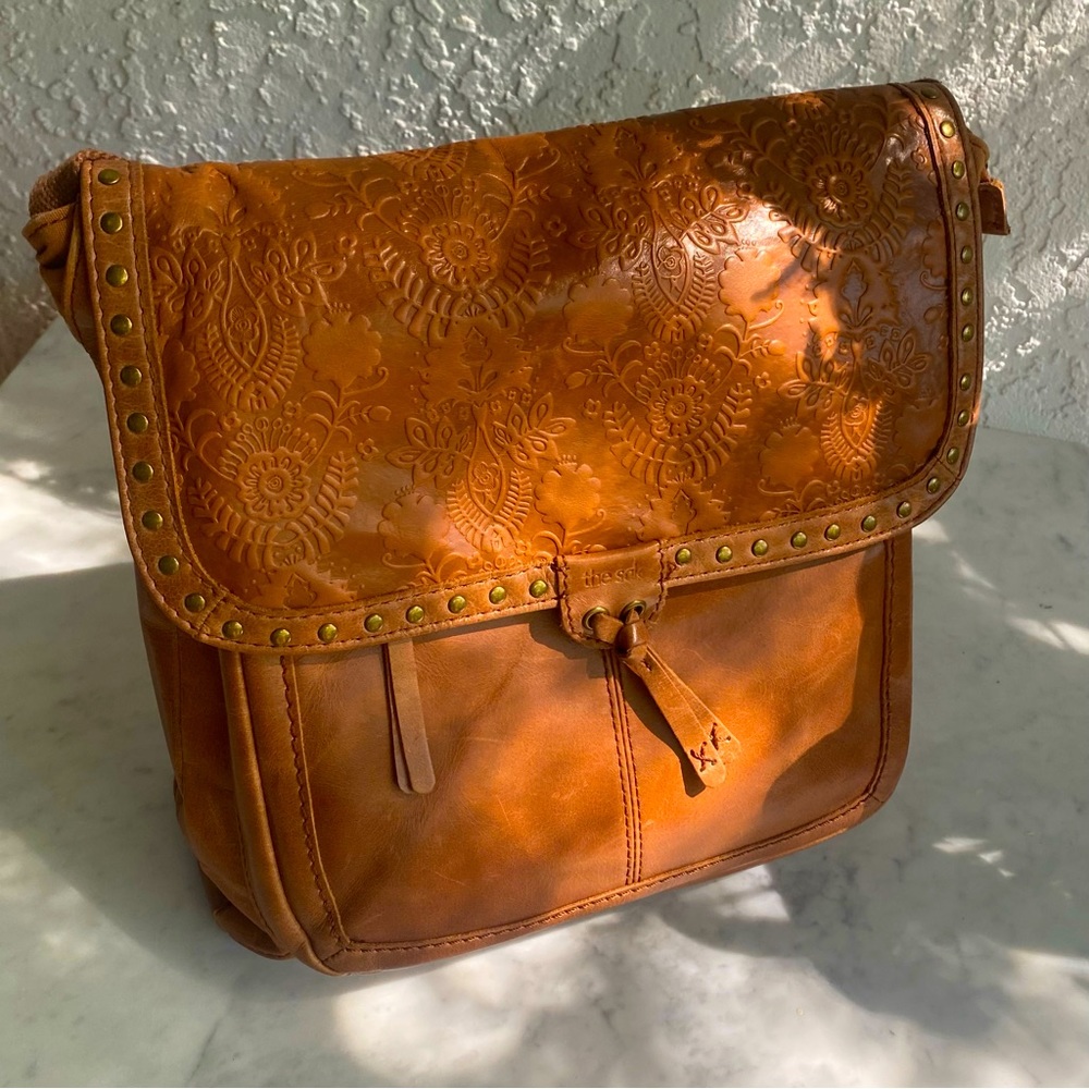 The Sak brown tooled leather backpack/shoulder bag
